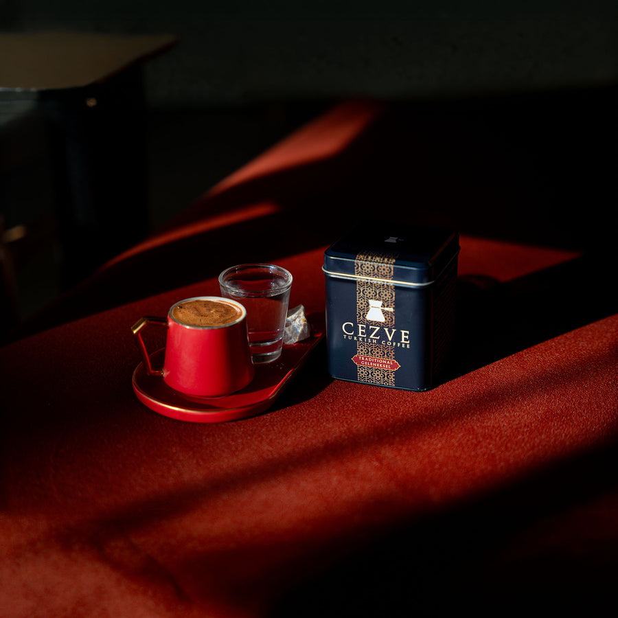 Cezve tin on crimson velvet with Turkish coffee cup